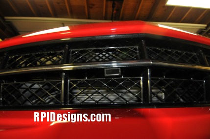 c7 curb alert mounted in grille